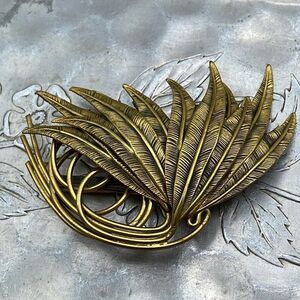 Vintage large ornate plume brooch . Antique brass finish .